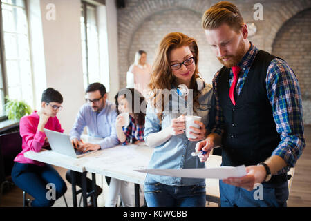 Portrait of two young perspective designers discussing Stock Photo