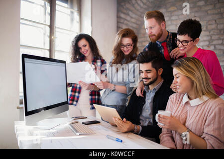 Group of young architects using digital tablet Stock Photo