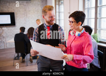 Portrait of two architects looking at project scheme Stock Photo