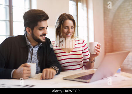 Two young perspective architects working on laptop Stock Photo