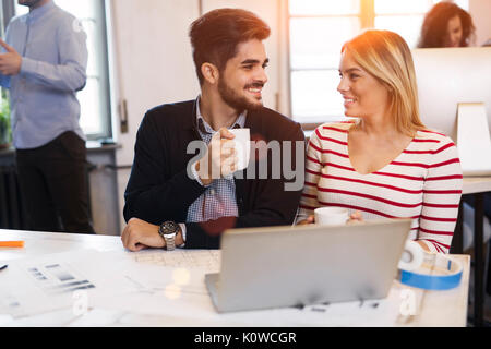 Two young perspective architects working on laptop Stock Photo