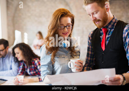 Portrait of two young perspective designers discussing Stock Photo