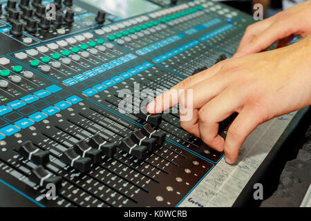 Hand on a mixer, operating the leader Stock Photo