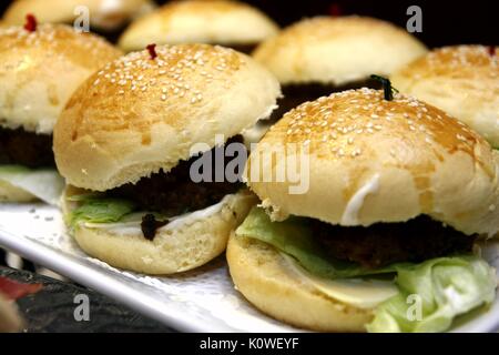 Photo of hamburger sandwiches served on a tray Stock Photo