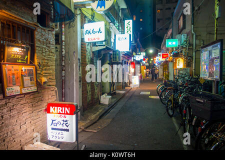 TOKYO, JAPAN JUNE 28 - 2017: Traditional back street bars in Shinjuku Golden Gai. Golden gai consists of 6 tiny alleys with 200 tiny bars and 20th century atmosphere, located in Tokyo Stock Photo