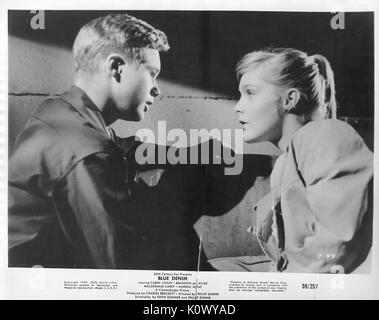 A movie still scene from 'Blue Denim' (1959 20th Century Fox film), showing a blonde teen-age girl revealing something very serious to a teen-age boy, 1959. Stock Photo