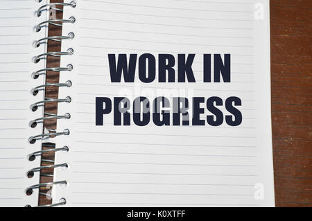 work in progress written on white paper, business concept background Stock Photo