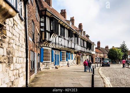 College street in York. The Tudor style buildings is the St Williams College founded in 1461, located within a very short distance of the Minster. Stock Photo