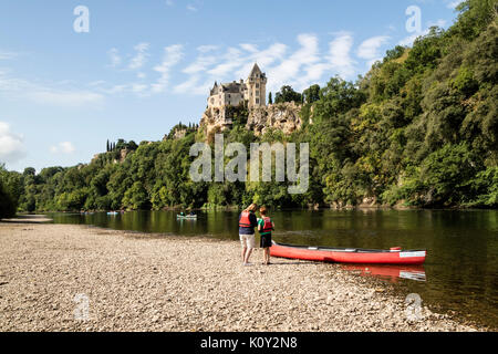 Canoeists on the Dordogne River Below the Chateau de Montfort, Dordogne, Aquitaine, France, Europe Stock Photo