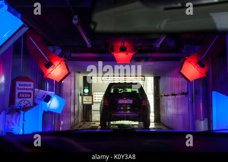 Clean the cockpit of the car with a spray Stock Photo - Alamy