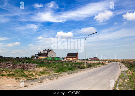 Last buildings in a ghost village at the edge of the open pit mine Garzweiler II in Germany Stock Photo