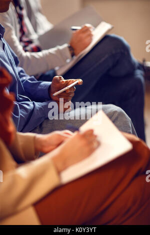 Close up of writing notes on business meeting, concept Stock Photo