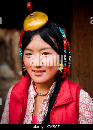 Traditional Tibetan girl. Kham, Tibetan plateau Stock Photo