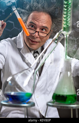 Crazy chemist doing experiment in chemical laboratory Stock Photo