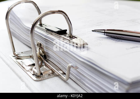 Pen on file folder with documents, storage of contracts. selective focus. Stock Photo