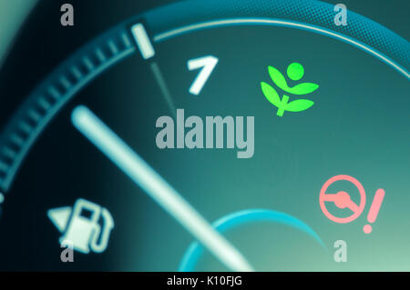 Eco drive light icon on car dashboard. Eco-driving concept Stock Photo