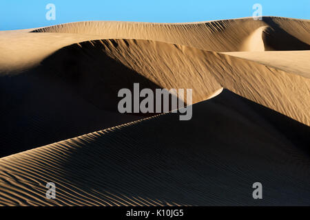 Abstract desert sand dunes with deep shadows at Lac Naila, Morocco. Stock Photo