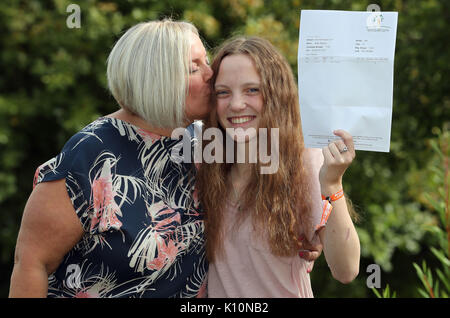 Millie Robson, 15, who was injured in the Manchester Bombings celebrates taking her GCSE English a year early, with her mother Marie, 43, at Woodham Academy in Newton Ayrcliffe. Stock Photo