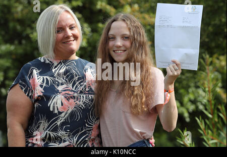 Millie Robson, 15, who was injured in the Manchester Bombings celebrates taking her GCSE English a year early, with her mother Marie, 43, at Woodham Academy in Newton Ayrcliffe. Stock Photo