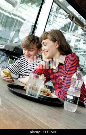 young teenage couple in cafe Stock Photo