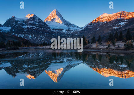 Mount Assiniboine reflected in Lage Magog in early morning, Mount Assiniboine Provincial Park, Rocky Mountains, British Columbia, Canada. Stock Photo