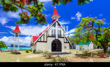 traditional catholic red church near the beach in Mauritius island. popular touristic attraction Stock Photo