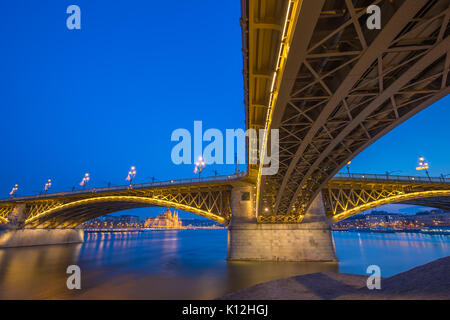 Budapest, Hungary - The beautiful illuminated Margaret Bridge with the Parliament of Hungary at blue hour Stock Photo