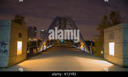 Humber Bay Arch Bridge with downtown Toronto seen in distance.