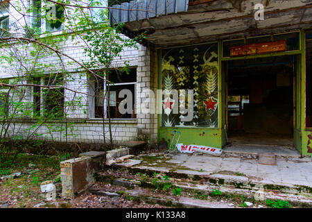 Old abandoned high-rise buildings in a dead radioactive zone. Looting and vandalism. Consequences of the Chernobyl nuclear disaster, August 2017. Stock Photo