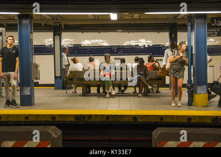 People wait for trains at the Jay Street MetroTech subway station in