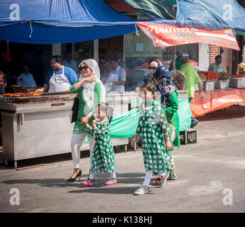 Pakistani-Americans celebrate Pakistani Independence Day at a 'Mela' or gathering on Coney Island Avenue in Brooklyn in New York on Sunday, August 20, 2017. Beside entertainment the street fair featured merchants selling ethnic clothing and foods of Pakistan. (© Richard B. Levine) Stock Photo