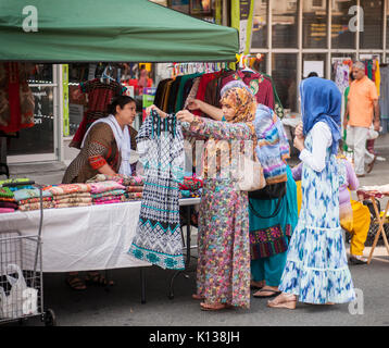 Pakistani-Americans celebrate Pakistani Independence Day at a 'Mela' or gathering on Coney Island Avenue in Brooklyn in New York on Sunday, August 20, 2017. Beside entertainment the street fair featured merchants selling ethnic clothing and foods of Pakistan. (© Richard B. Levine) Stock Photo