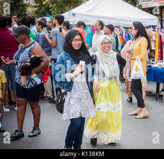 Pakistani-Americans celebrate Pakistani Independence Day at a 'Mela' or gathering on Coney Island Avenue in Brooklyn in New York on Sunday, August 20, 2017. Beside entertainment the street fair featured merchants selling ethnic clothing and foods of Pakistan. (© Richard B. Levine) Stock Photo