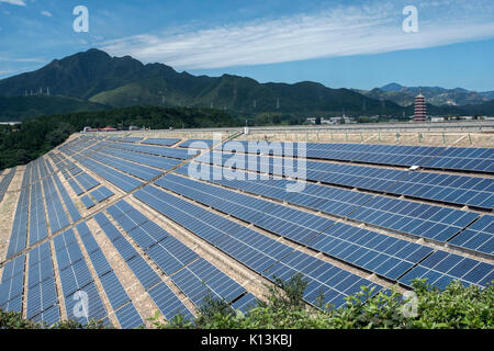 Photovoltaic solar panels on the dam of Yanqi Lake in Huairou, Beijing, China. 24-Aug-2017 Stock Photo