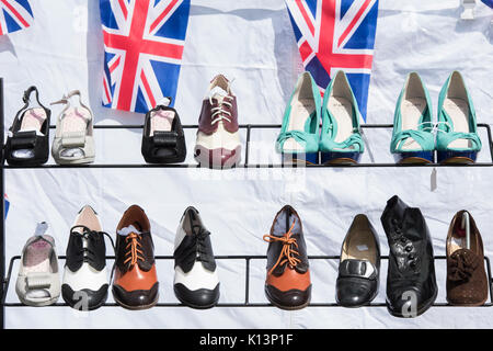 Vintage style mens and ladies shoes for sale on a stand at a vintage retro festival. UK Stock Photo