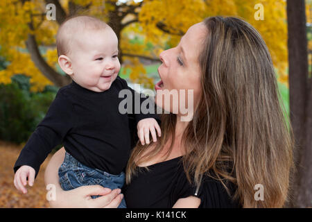 mother talking to baby Stock Photo