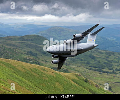 The USAF C-17 Globemaster 23292 from the Air Mobility Command made a first appearance for its aircraft type in the Mach Loop, Wales, UK (low Flying Ar Stock Photo
