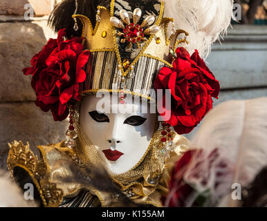 Venice, Italy- February 18th, 2012: Portrait of a person wearing a beautiful mask during the Venice Carnival Stock Photo
