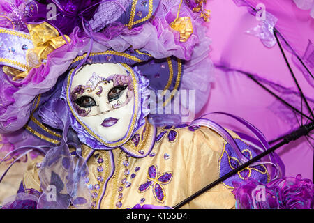 Venice,Italy-February 26, 2011: Image of a person disguised in a complex Venetian costume during the Venice Carnival days. Stock Photo