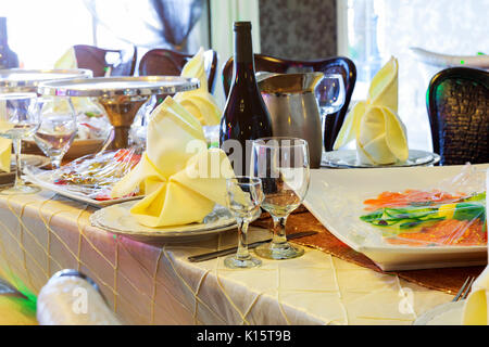catering table set service with silverware, napkin and glass at restaurant Stock Photo
