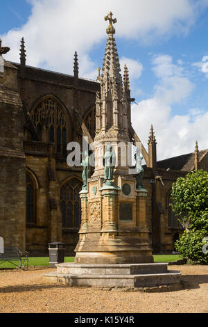 The Digby Memorial (Victorian stone monument with bronze figures)outside the Abbey church of St Mary the Virgin (Sherborne Abbey), Sherborne, Dorset Stock Photo