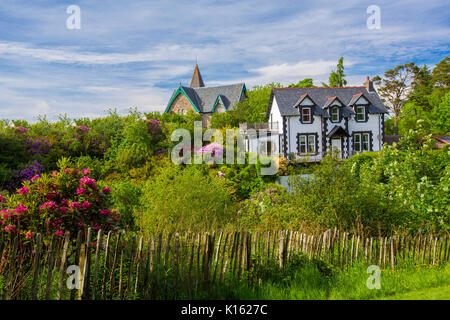 Black and white house with colourful garden at Scottish town of Oban Stock Photo