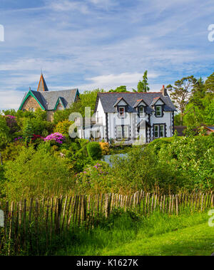 Black and white house with colourful garden at Scottish town of Oban Stock Photo