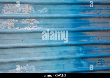 Wavy walls are made ​​of aluminum is painted in shades of blue. Stock Photo