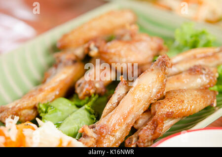 barbecue chicken wings  on dish shot with selective focus Stock Photo
