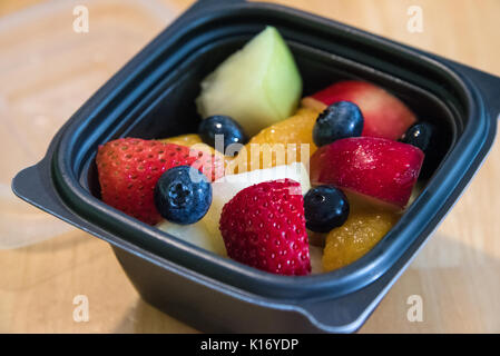 A fresh fruit cup side item offers a healthy and delicious option at Chick-fil-A restaurants, the top-rated quick service restaurant chain in the US. Stock Photo