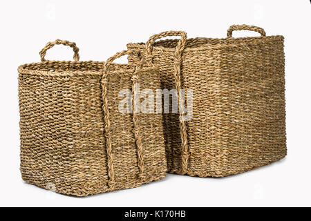 SET OF TWO LARGE RECTANGULAR NATURAL PLANT FIBRE BRAIDED BASKET WITH HANDLES  ISOLATED ON WHITE BACKGROUND Stock Photo