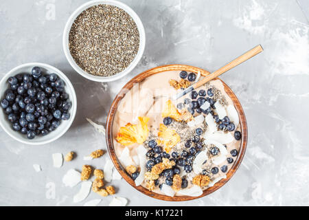 Chocolate smoothies bowl with chia, blueberry and coconut. Stock Photo