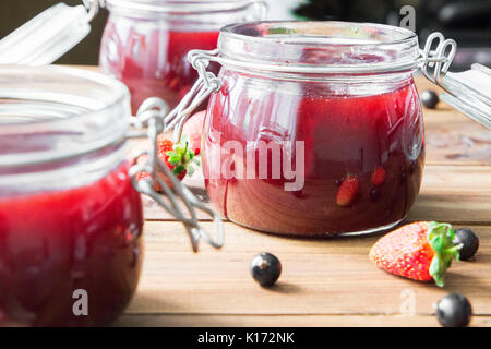 Homemade jam with berries on the wooden table Stock Photo