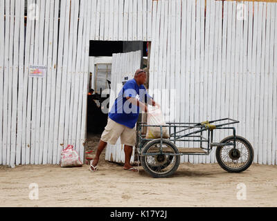 Kalibo, Philippines - Dec 17, 2015. People with the cart on street in Boracay island, Philippines. Boracay Island and its beaches have received awards Stock Photo